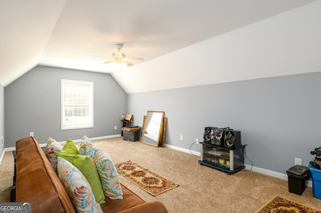 interior space with lofted ceiling, ceiling fan, carpet flooring, and baseboards