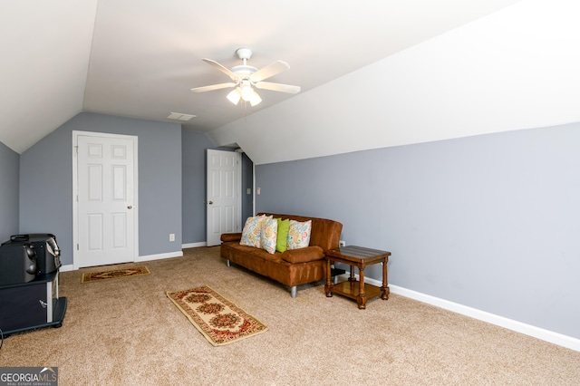 living area with visible vents, baseboards, lofted ceiling, ceiling fan, and carpet flooring