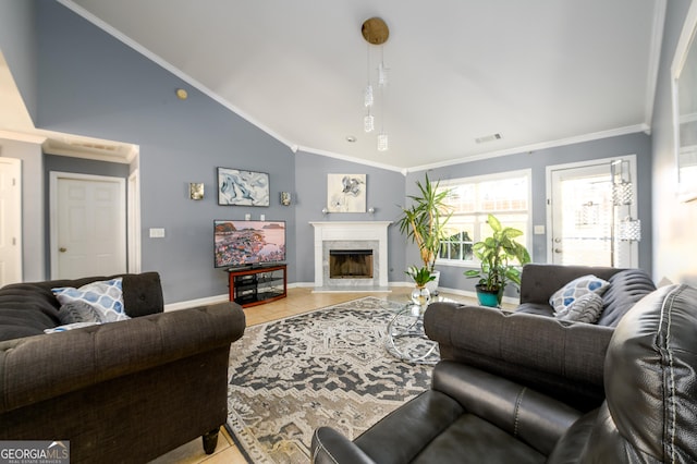 living area with a fireplace, crown molding, visible vents, and baseboards