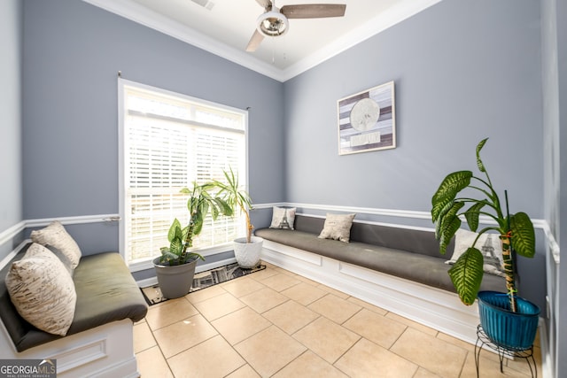 living area with a ceiling fan, tile patterned flooring, and crown molding