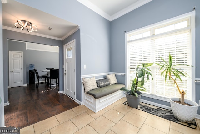 living area with tile patterned flooring, visible vents, ornamental molding, and baseboards