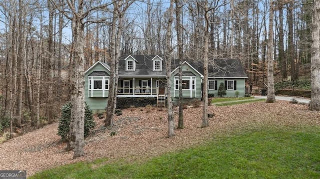 cape cod-style house with a porch