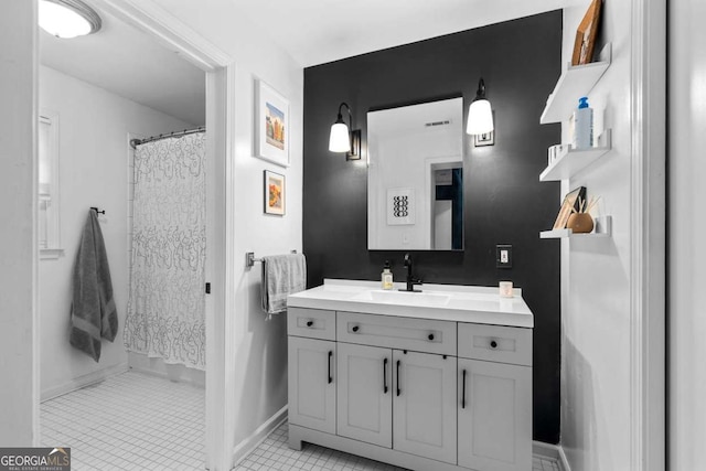 full bath with a shower with shower curtain, vanity, visible vents, and tile patterned floors