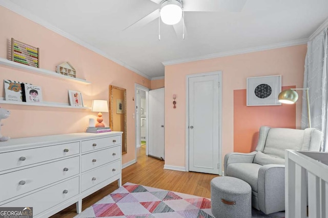 bedroom featuring light wood-type flooring, baseboards, ornamental molding, and ceiling fan