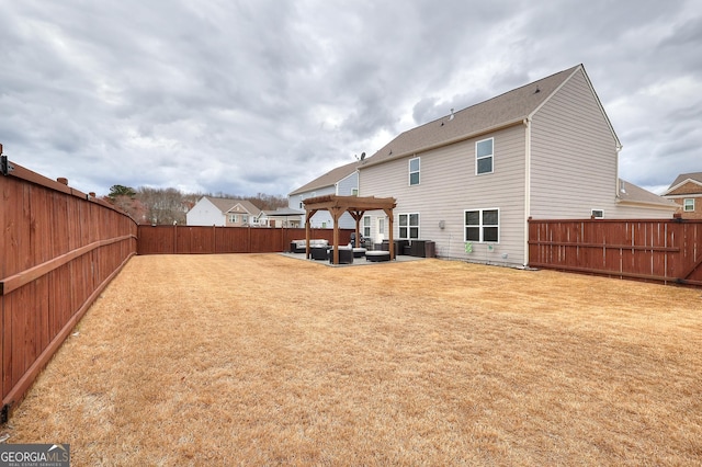 back of house with a fenced backyard, a patio, a lawn, and a pergola