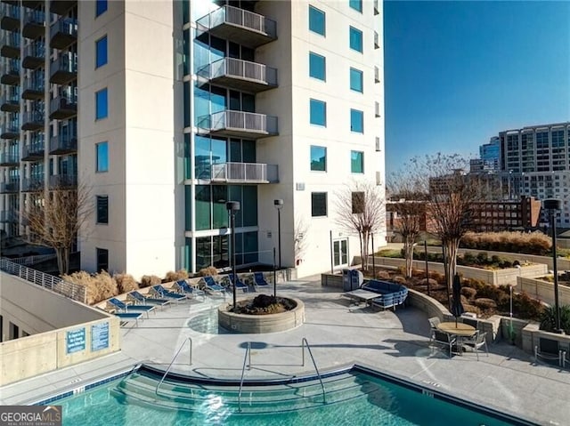 view of pool featuring a patio area