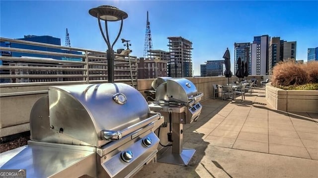 view of patio featuring a view of city and area for grilling