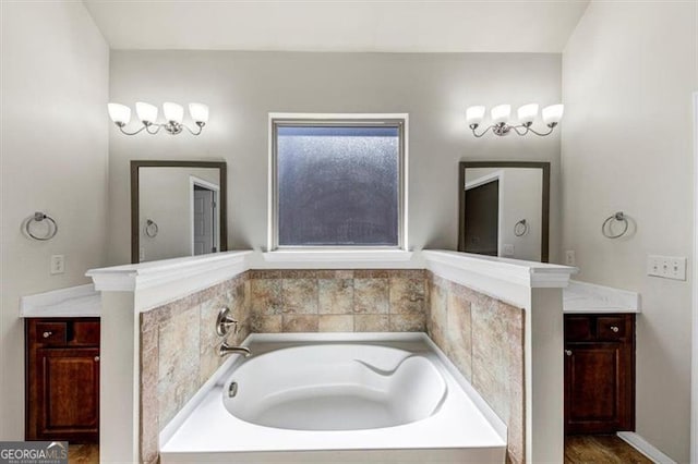 full bath with a garden tub and vanity