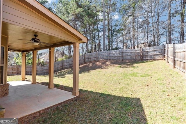 view of yard with a patio, a fenced backyard, and a ceiling fan