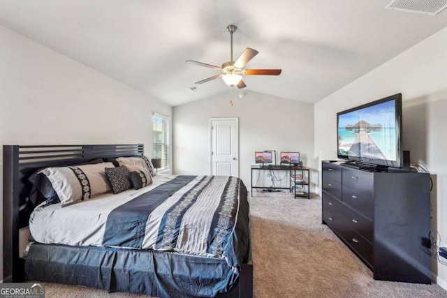 carpeted bedroom featuring vaulted ceiling, ceiling fan, and visible vents