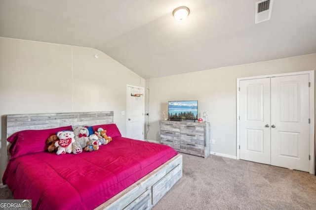 carpeted bedroom featuring lofted ceiling, baseboards, visible vents, and a closet