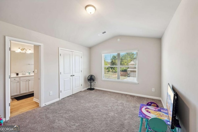 game room with baseboards, visible vents, vaulted ceiling, and carpet flooring