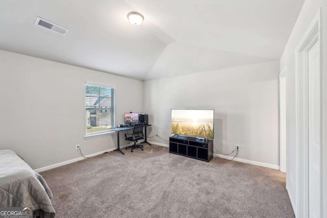 carpeted bedroom with lofted ceiling, baseboards, and visible vents