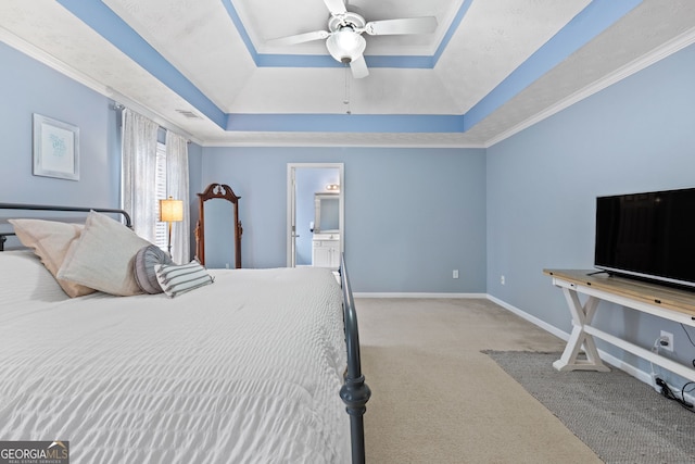 bedroom featuring crown molding, a raised ceiling, visible vents, carpet flooring, and baseboards