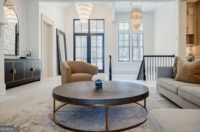 living area featuring a notable chandelier