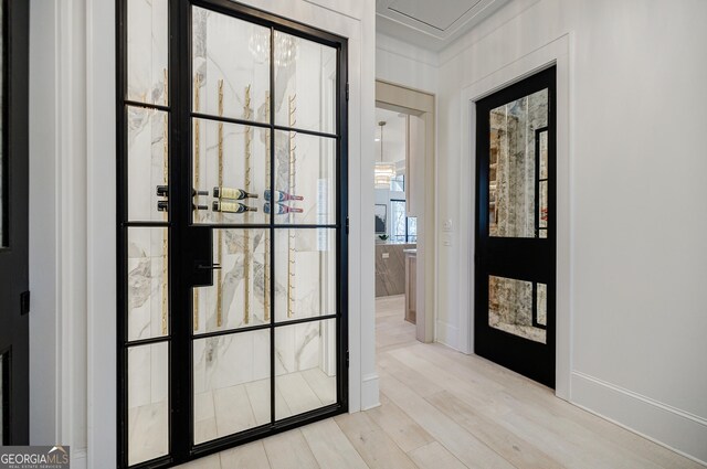 entryway with wood finished floors