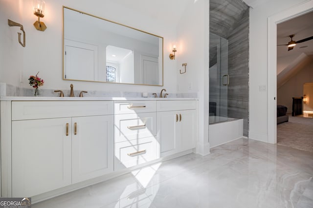 full bath featuring a sink, a ceiling fan, marble finish floor, and double vanity