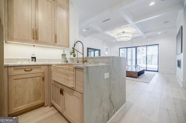 kitchen with visible vents, beamed ceiling, light brown cabinets, coffered ceiling, and a peninsula