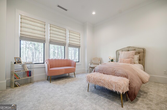 carpeted bedroom featuring recessed lighting, visible vents, baseboards, and crown molding