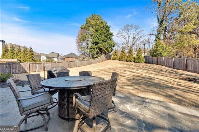 view of patio / terrace featuring outdoor dining area and a fenced backyard