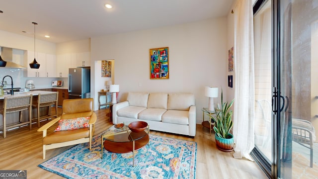 112 Rogers St Unit 409, Atlanta, GA 30317 - living room featuring light wood-style flooring and recessed lighting