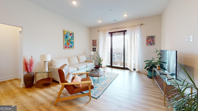 112 Rogers St Unit 409, Atlanta, GA 30317 - living area featuring baseboards, recessed lighting, and light wood-style floors