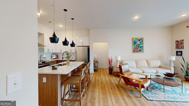112 Rogers St Unit 409, Atlanta, GA 30317 - living area featuring light wood-style floors and recessed lighting