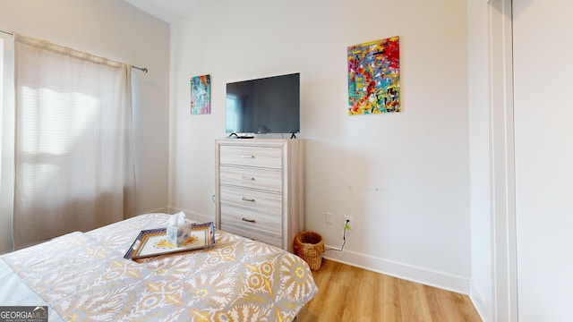 112 Rogers St Unit 409, Atlanta, GA 30317 - bedroom with light wood-type flooring and baseboards