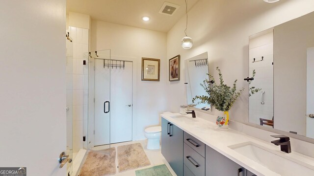 112 Rogers St Unit 409, Atlanta, GA 30317 - full bath with toilet, a stall shower, visible vents, and a sink