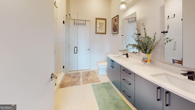 112 Rogers St Unit 409, Atlanta, GA 30317 - bathroom with double vanity, a sink, toilet, and a shower stall