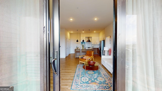 112 Rogers St Unit 409, Atlanta, GA 30317 - hallway with light wood-type flooring and recessed lighting