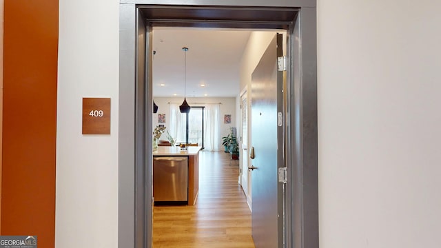 112 Rogers St Unit 409, Atlanta, GA 30317 - corridor featuring light wood-style flooring and recessed lighting
