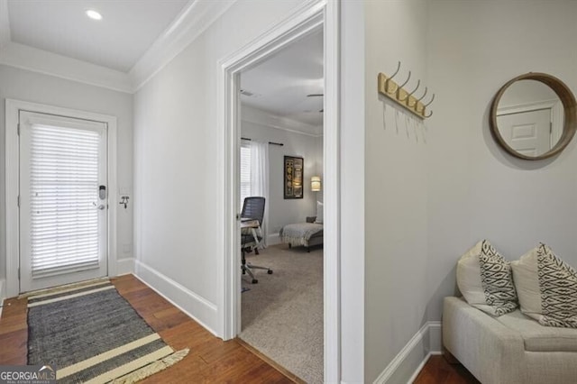 interior space with recessed lighting, baseboards, a wealth of natural light, and wood finished floors