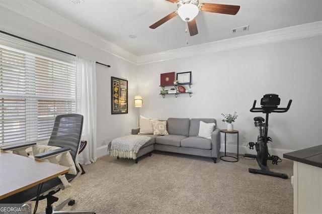 office featuring carpet floors, visible vents, and crown molding