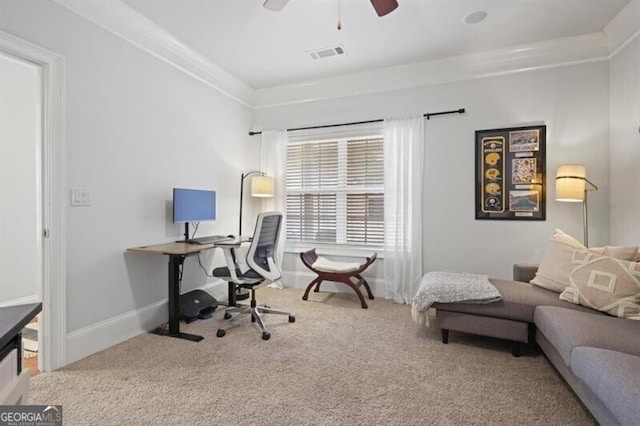 carpeted office featuring baseboards, visible vents, ceiling fan, and ornamental molding