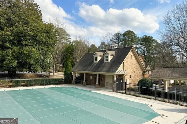 view of pool with a patio area, fence, and a fenced in pool