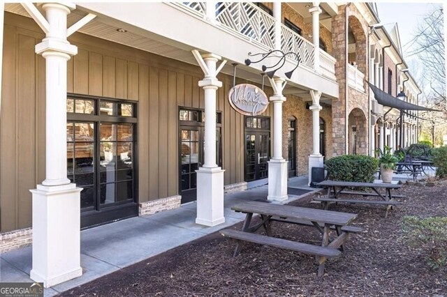 entrance to property with a balcony