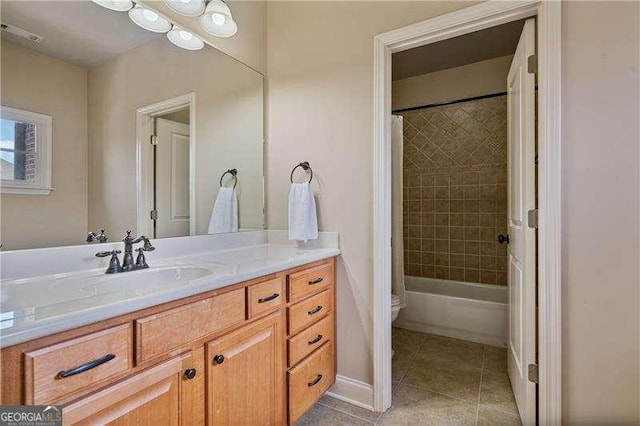 full bath with toilet, tile patterned floors, vanity, visible vents, and shower / tub combo with curtain