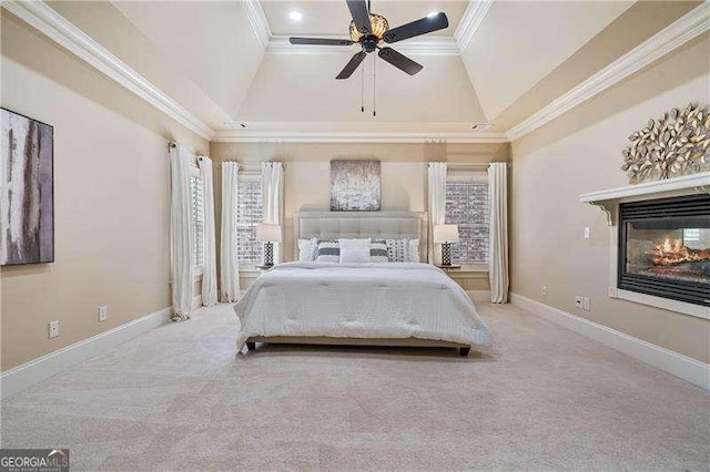 carpeted bedroom with ceiling fan, baseboards, crown molding, and a multi sided fireplace