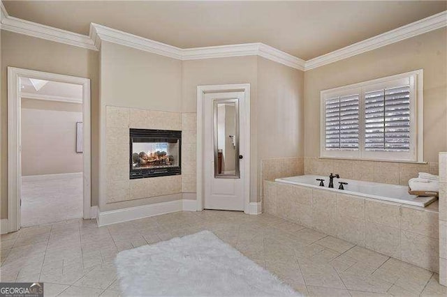 full bath with a bath, crown molding, a tiled fireplace, and tile patterned floors