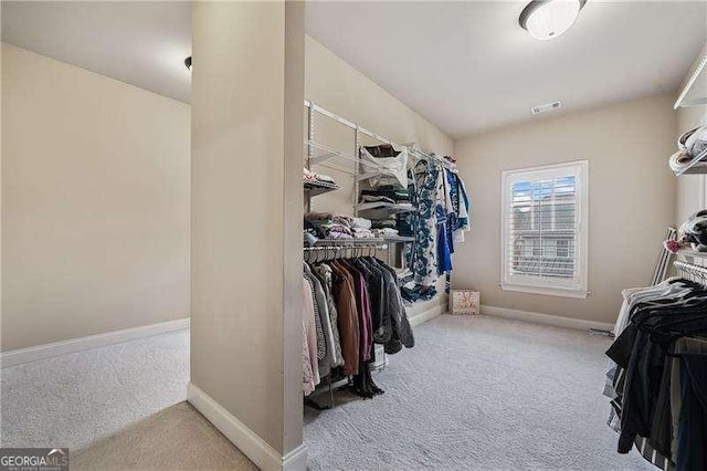 spacious closet featuring carpet floors and visible vents