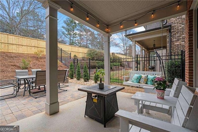 view of patio / terrace with fence, an outdoor living space, and outdoor dining space