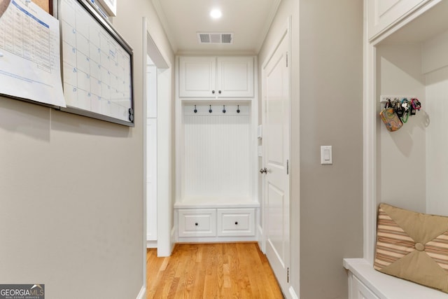 mudroom with visible vents and light wood-style flooring