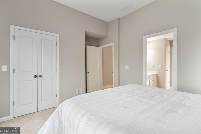 bedroom featuring a closet, carpet, and visible vents