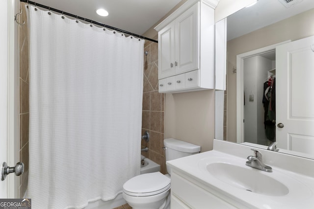 full bathroom with shower / bath combo with shower curtain, toilet, and vanity