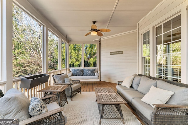 sunroom with a ceiling fan