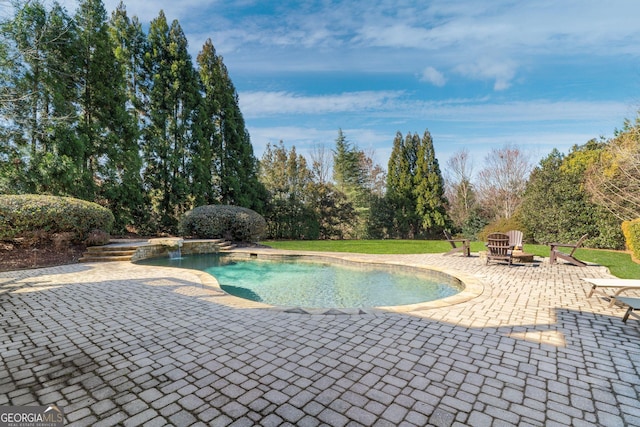 pool with a patio area