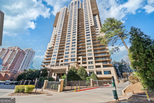 3481 Lakeside Dr NE Unit 2303, Atlanta, GA 30326 - view of building exterior with fence