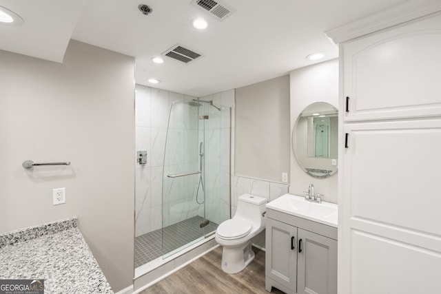 3481 Lakeside Dr NE Unit 2303, Atlanta, GA 30326 - full bath with vanity, wood finished floors, a marble finish shower, and recessed lighting