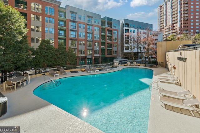 3481 Lakeside Dr NE Unit 2303, Atlanta, GA 30326 - pool with a patio and fence